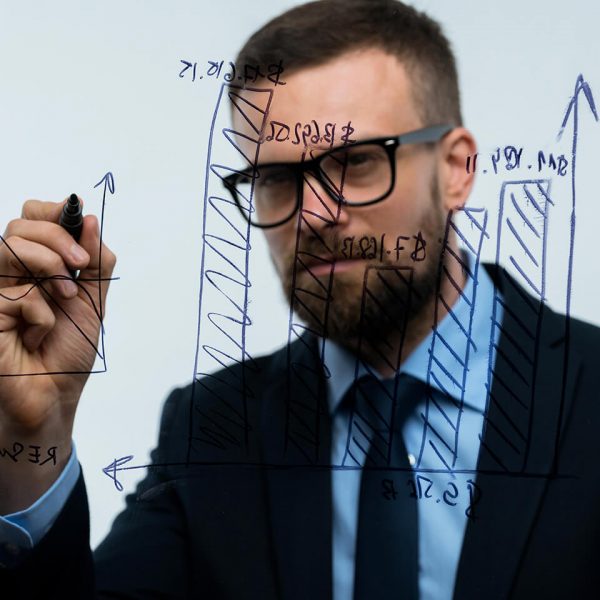 man-draws-various-growth-charts-calculating man-draws-various-growth-charts-calculating